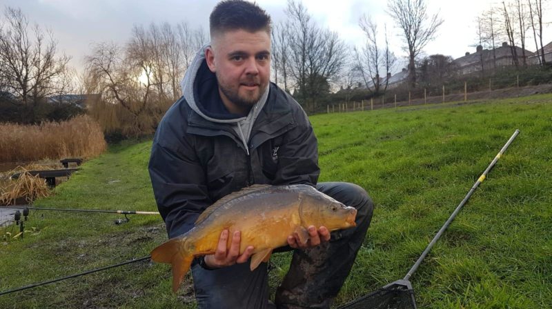 Local angler Tom Middleton with the Mirror Carp he caught in Arourthorne Pond. Photo taken prior to current lockdown restrictions